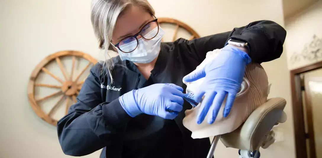 instructor demonstrating a dental examination instructor demonstrating a dental examination