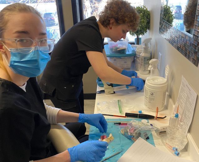 students creating dental molds in the lab students creating dental molds in the lab