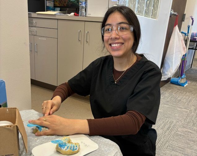 student creating a dental mold in class student creating a dental mold in class